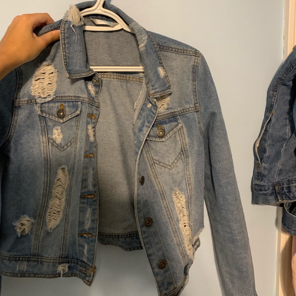 Light washed, ripped jean jacket